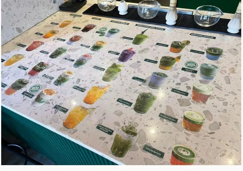 A colorful modern matcha drinks menu board showing dozens of matcha-based drink varieties